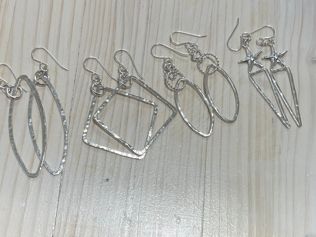 Assorted silver earrings